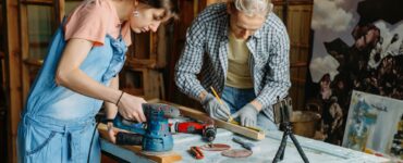 Man and woman doing refurbishment of furniture