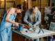 Man and woman doing refurbishment of furniture